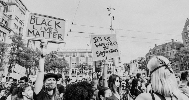 protesters holding signs