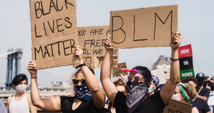 people protesting and holding signs